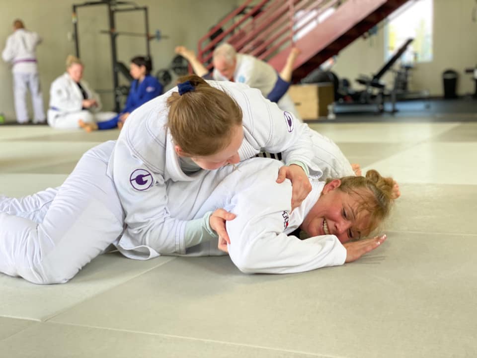 Two women training jiu-jitsu at prodigy martial arts in blaine mn